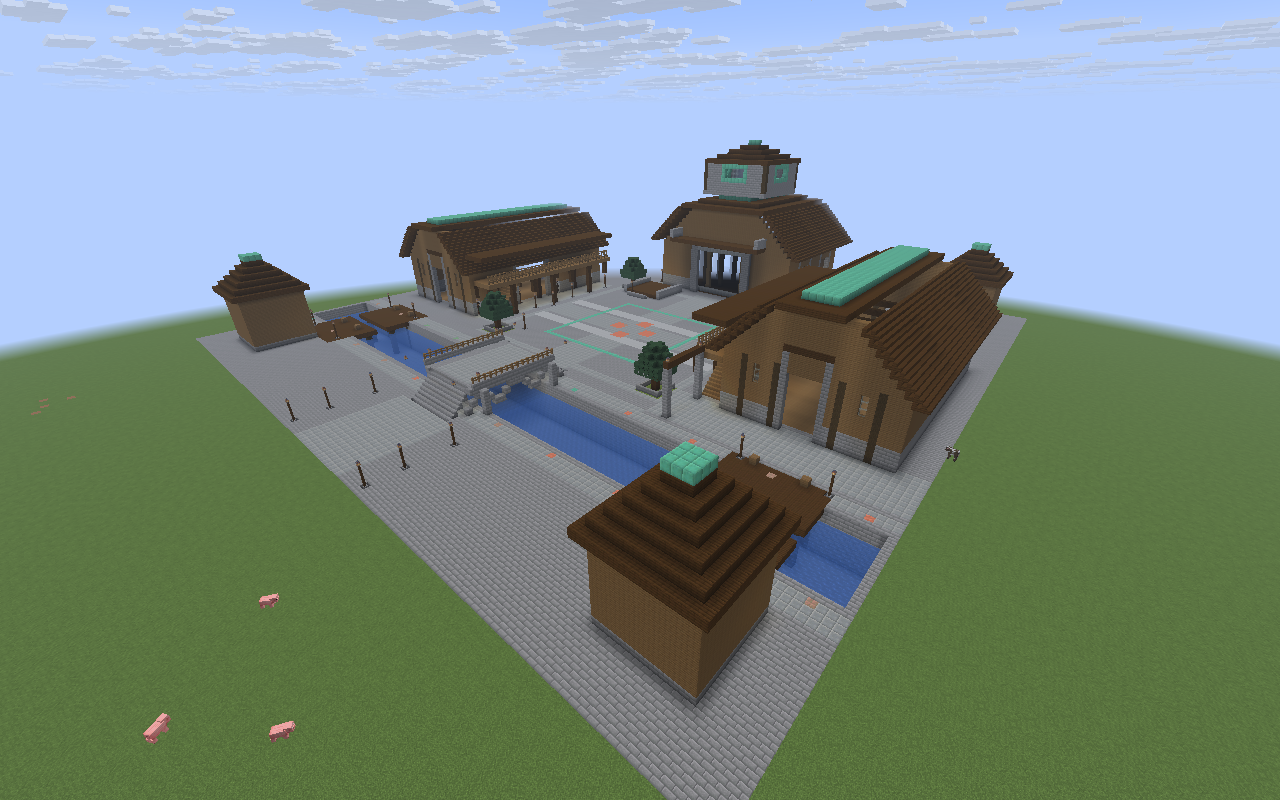 Aerial view of Oxbow’s grand hub: a great hall and market halls around a stone court, with a canal and arched bridge.